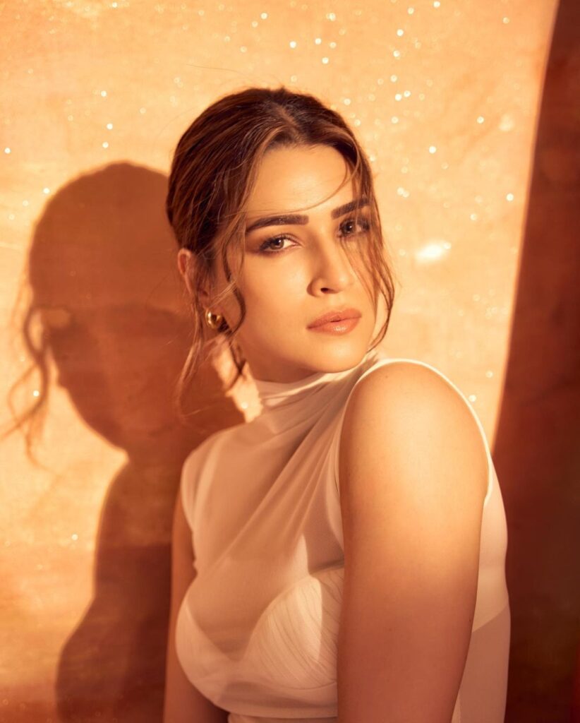 Image of Kriti Sanon, a renowned Bollywood actress, posing gracefully for a photo. She exudes elegance and charm, captivating the viewer with her radiant smile and poised demeanorkriti sanon photo